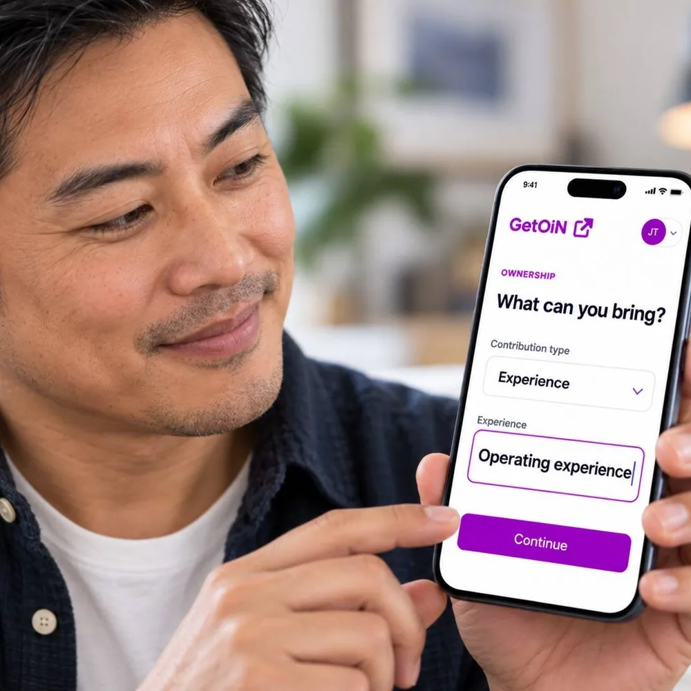 Man holding a phone showing GetOiN Ownership: What can you bring? Experience, operating experience