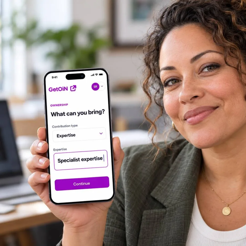 Woman holding a phone showing GetOiN Ownership: What can you bring? Expertise, specialist expertise