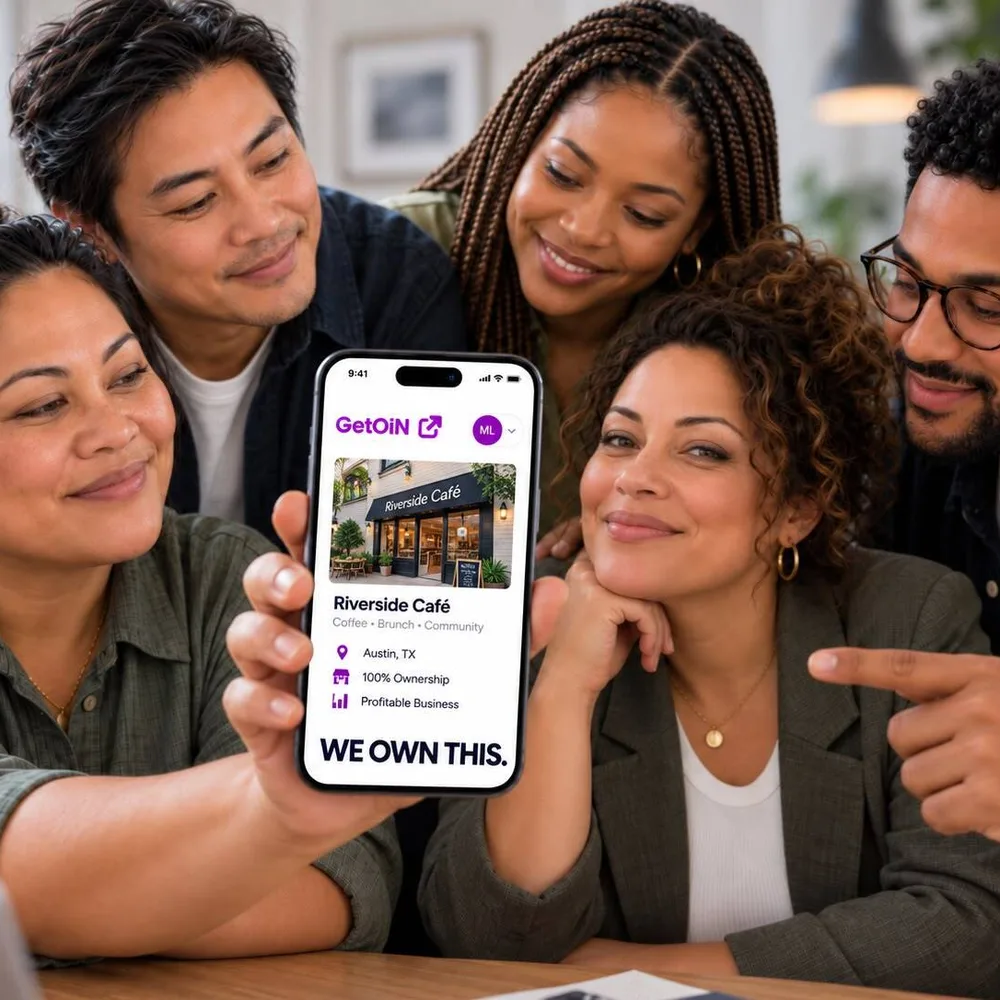 Group of five people around a phone showing Riverside Café on GetOiN with the words We own this