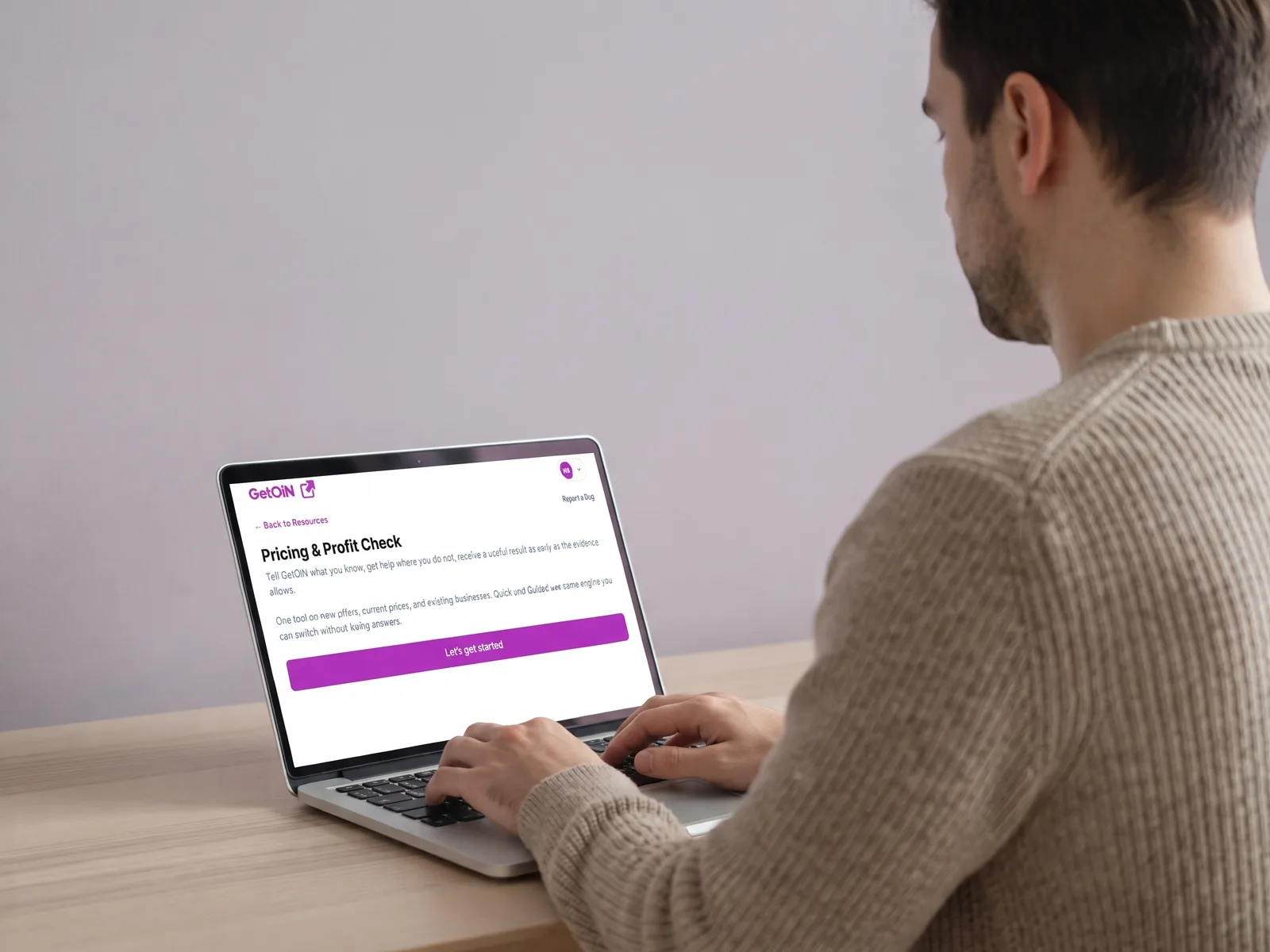 Man using the GetOiN Pricing & Profit Check on his laptop